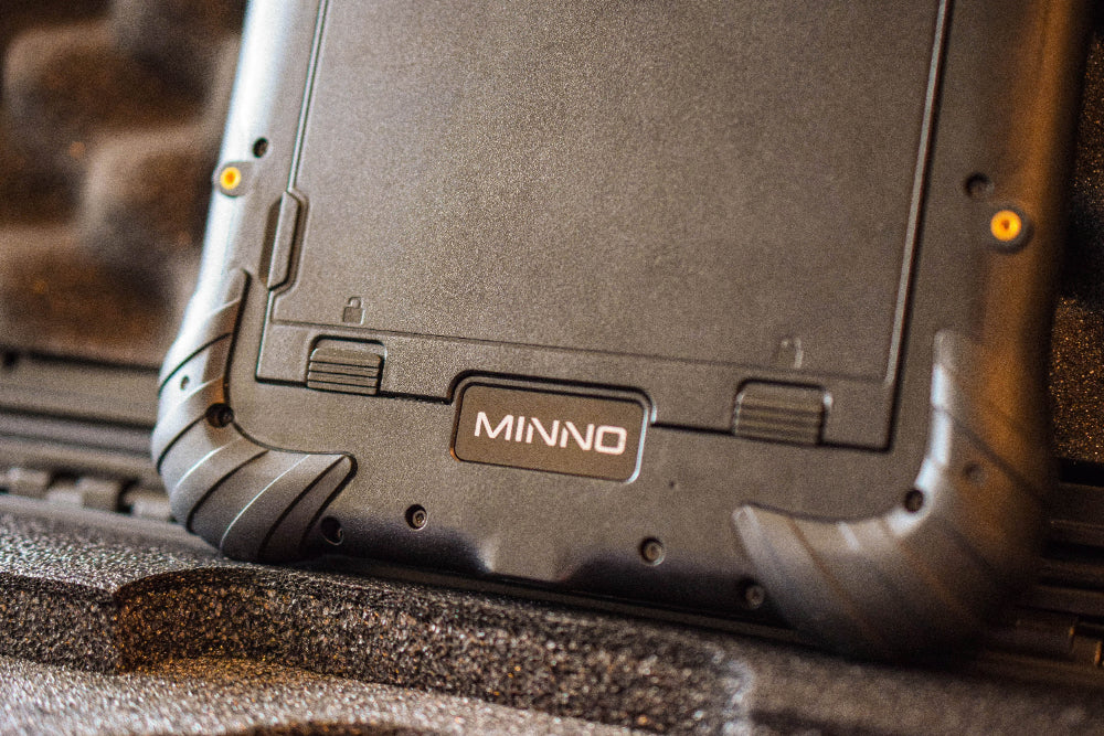 A close-up look at the back of a MINNO Android tablet. The "MINNO" label is clearly displayed on the back of the tablet.