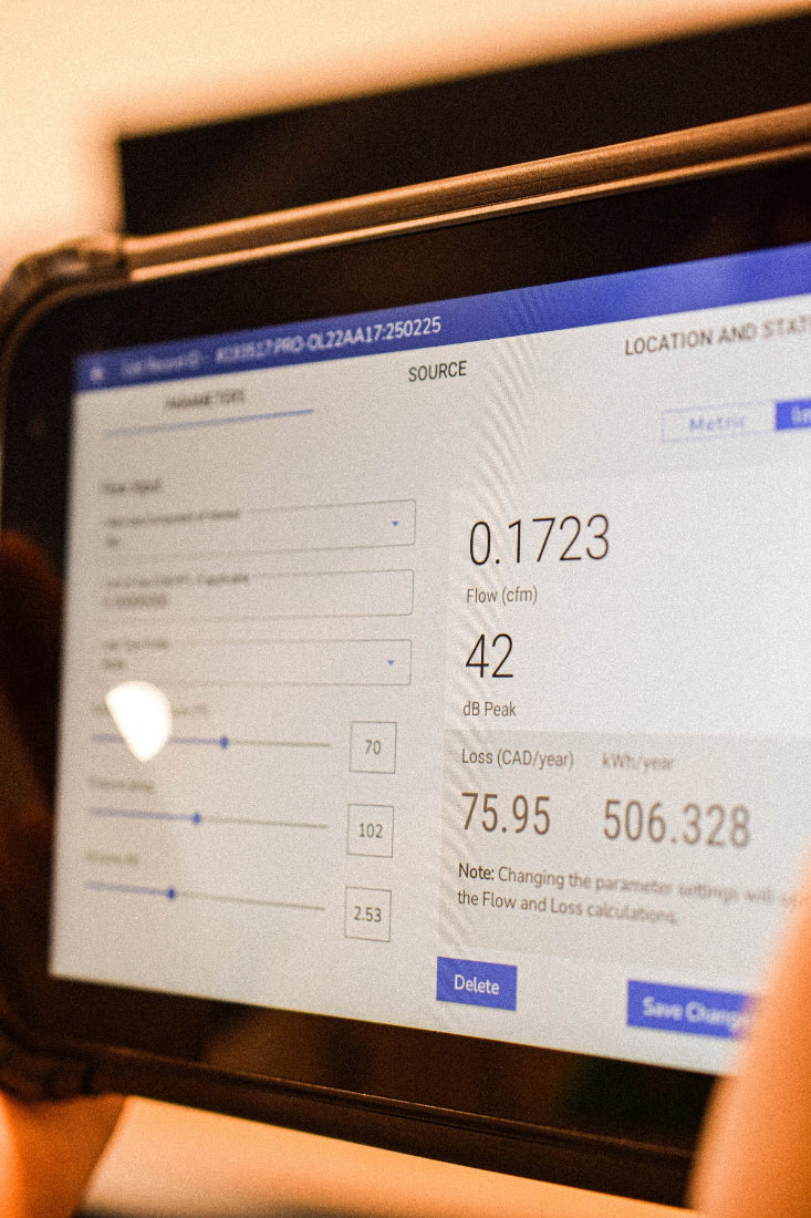 A leak record is displayed on a tablet. Flow, dB peak, dollar loss, and other important information is shown on the leak record.