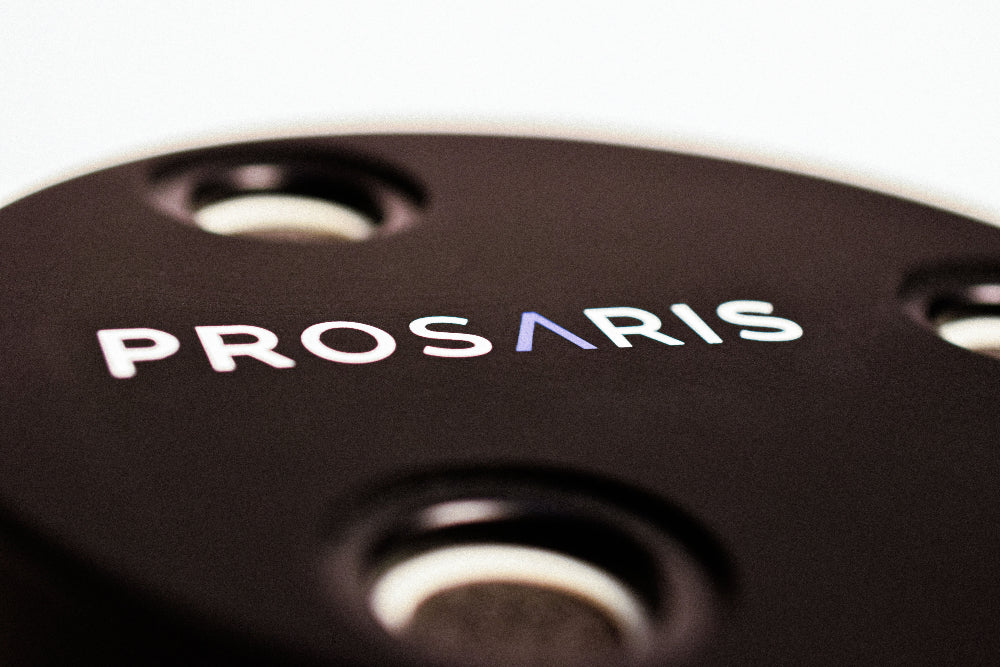 A close up look at a PROSARIS OL1 ultrasonic sensor. The PROSARIS logo is printed on the front of the device.